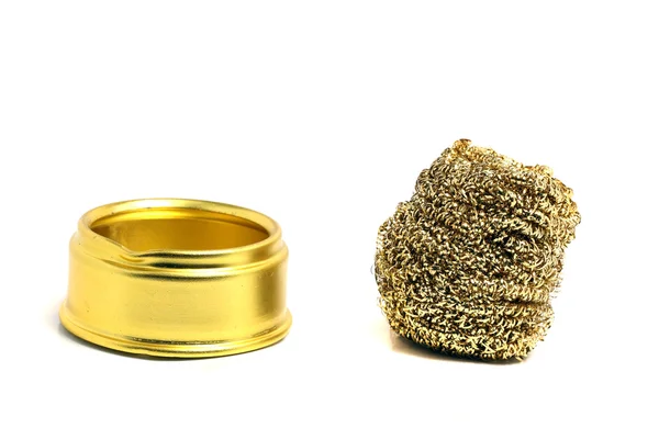 Metal sponge golden color and a stand — Stock Photo, Image