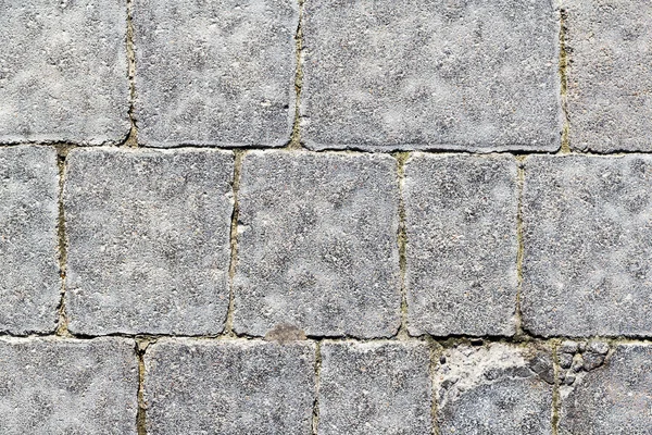 Textura fuerte mampostería de piedra en la pista — Foto de Stock