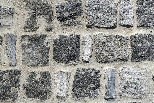 Textura forte alvenaria de pedra na pista — Fotografia de Stock