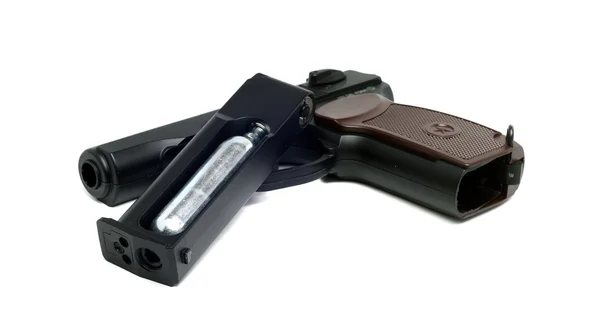 Una copia fiel de la pistola de aire polvorienta sobre un fondo blanco —  Fotos de Stock