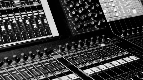 Sound equipment . The sound engineer works at the sound mixing panel in a show. professional music equipment