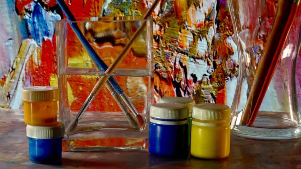 art brushes and paints . art painting . color background