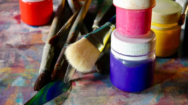 art brushes and paints . art painting . color background