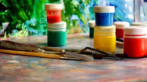 art brushes and paints . art painting . color background