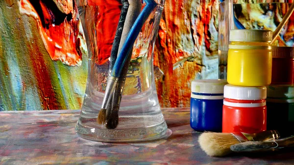 art brushes and paints . art painting . color background