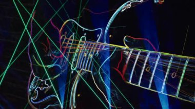 Duvar kağıdı. Renkli neon arkaplan. Neon ışığı gitarı 