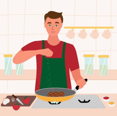 Adam mutfağında yemek pişiriyor. Kırmızı gömlekli ve yeşil önlüklü bir erkek kızartma tavasında biftek pişiriyor. Eldeki tuz. Çizgi film vektör illüstrasyonu