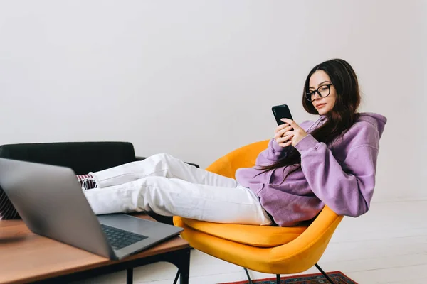 Young Caucasian Woman Using Mobile Phone Sitting Armchair Living Room — Stock Fotó