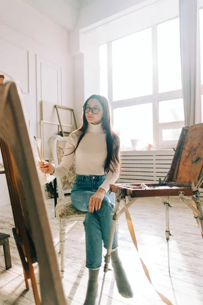 Young Caucasian Woman Artist Holding Paintbrush Draws Canvas Working Home — Stock Photo, Image