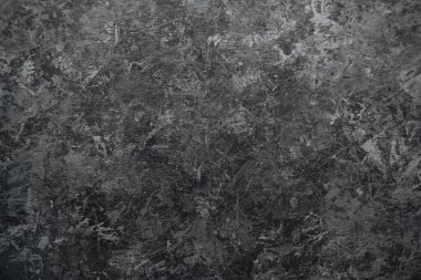 Koyu siyah taş duvar arkaplanı desenli yüzeyi.