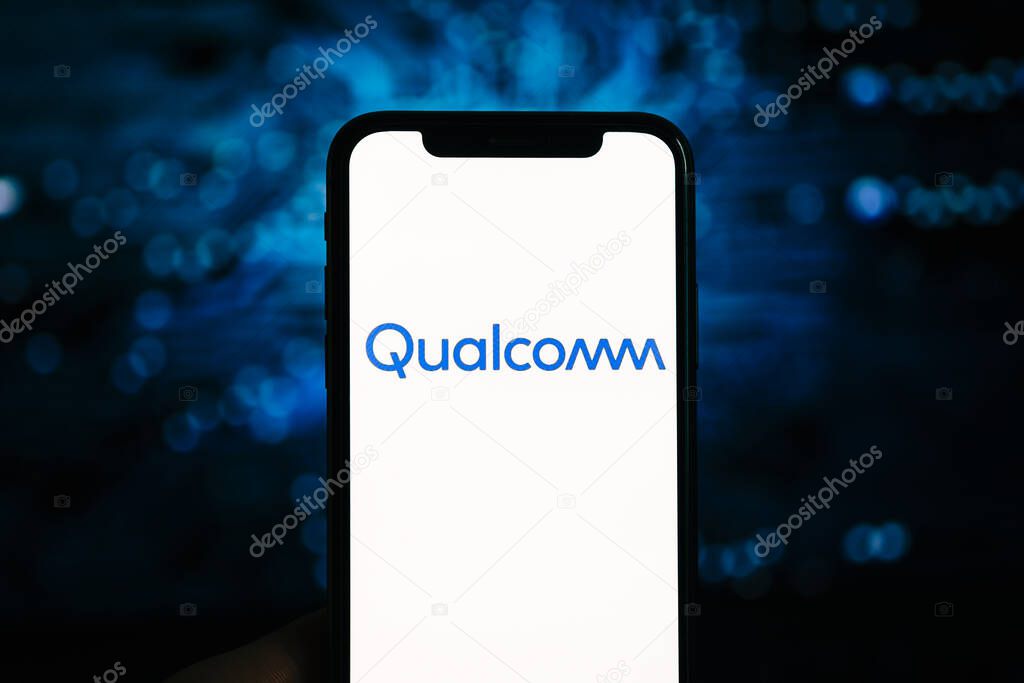 Qualcomm logo on the iPhone screen. Qualcomm is a company that manufactures processors for mobile devices.