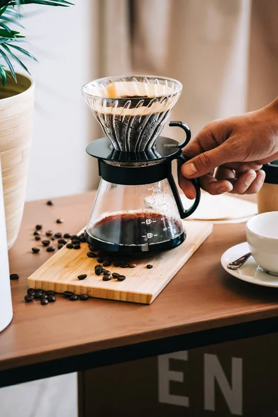 Alternative coffee brewing method, using pour over dripper and paper filter.