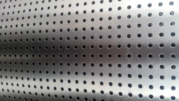Steel metal tube with holes — Stock Photo, Image