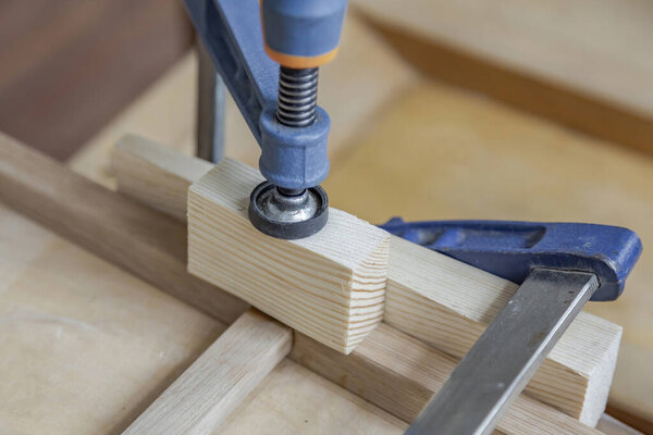 Mechanical working tool in a carpentry workshop. Manual production of wood and precious woods products