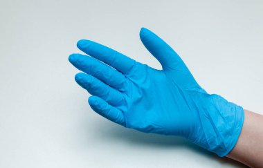 hands in protective medical gloves on a white background