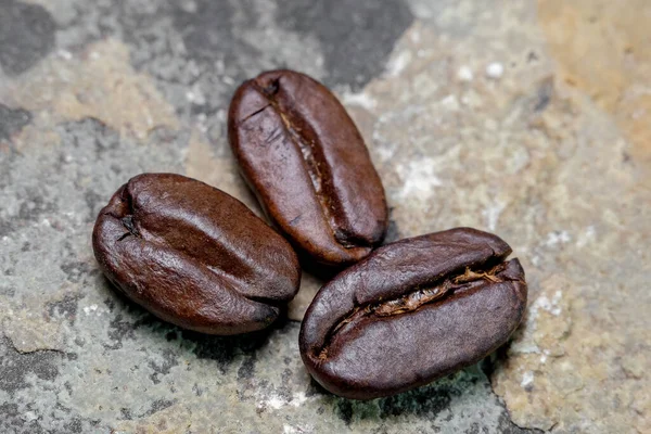 Black Coffee Grains Stone Background Close — Stock Photo, Image