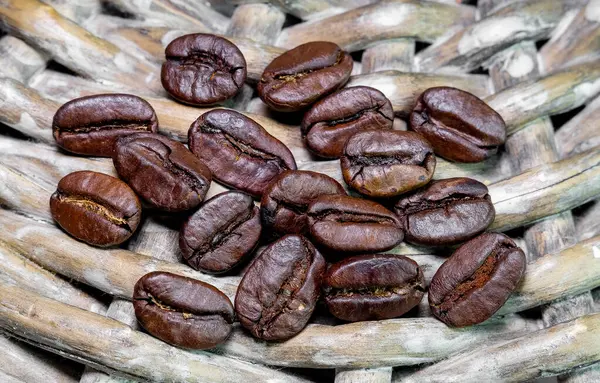 Close Black Coffee Grains Lying Braided Basket — Stock Photo, Image