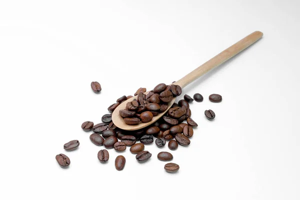 Black Coffee Grains Beautiful Handmade Wooden Spoon Scattered White Background — Stock Photo, Image