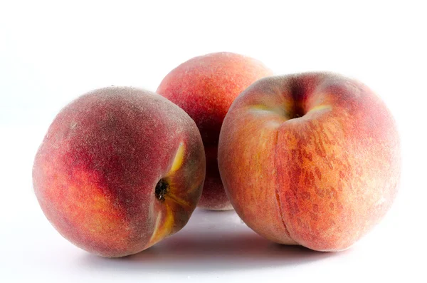 Three ripe peaches isolated on white background — Stock Photo, Image