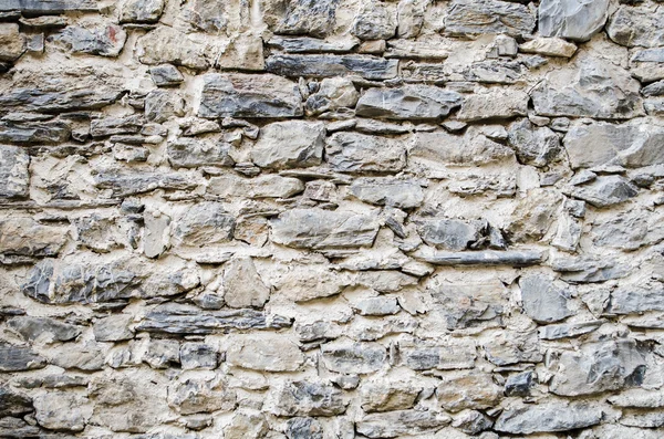 Ancient stone wall  in a castle in italy — Stock Photo, Image