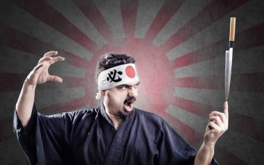 Sushi chef bıçak bir parmak üzerinde denge tutar