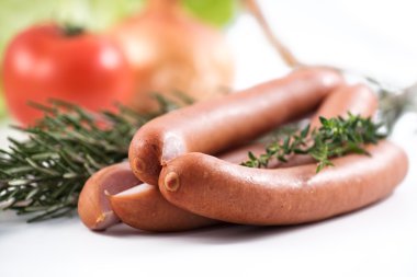 three german sausage and herbs that were used to prepare them clipart