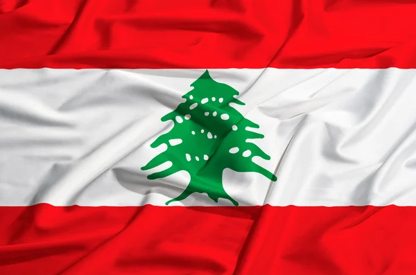 Bandera del Líbano sobre una cortina de seda ondeando — Foto de Stock