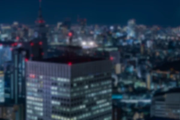 Onscherpe achtergrond van nacht weergave in een metropool — Stockfoto