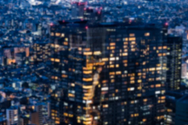 Onscherpe achtergrond van nacht weergave in een metropool — Stockfoto