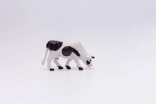 An old figurine or toy of a cow, — Stock Photo, Image