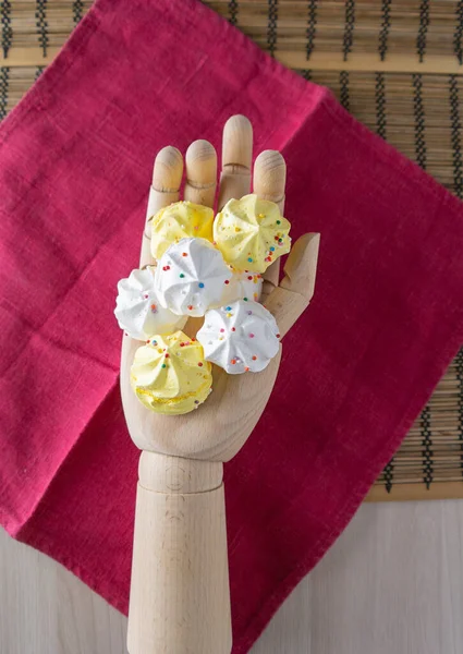 White Yellow Meringue Cakes Lie Wooden Hand Red Linen Napkin — Stock Photo, Image