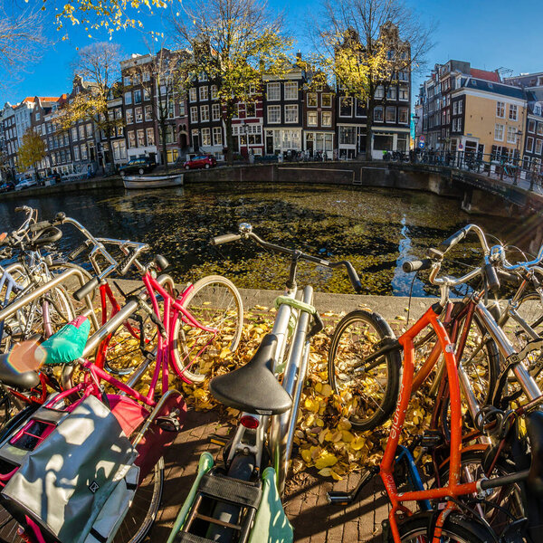 AMSTERDAM, THE NETHERLANDS - NOVEMBER 18, 2018: Urban scene in Amsterdam, the Netherlands. Fish eye view