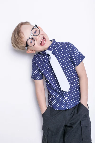 Little adorable kid in tie and glasses. School. Preschool. Fashion. Studio portrait isolated over white background — Stock Photo, Image