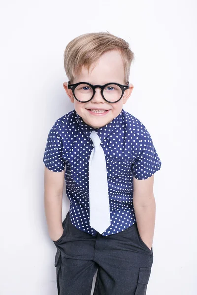 Little adorable kid in tie and glasses. School. Preschool. Fashion. Studio portrait isolated over white background — Stock Photo, Image