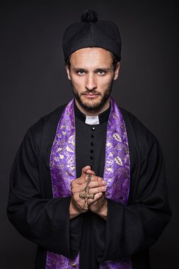 Humble priest with Christian Cross clipart