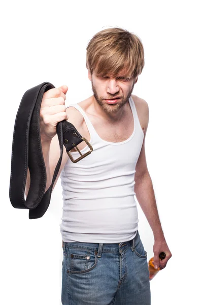 Angry man threatens with belt. Concept: Violence in the family. Abuse — Stock Photo, Image