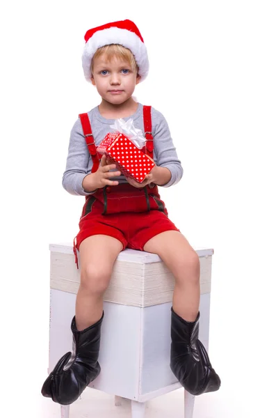 Beautiful little boy holding present from Santa Claus. Christmas. — Stock Photo, Image