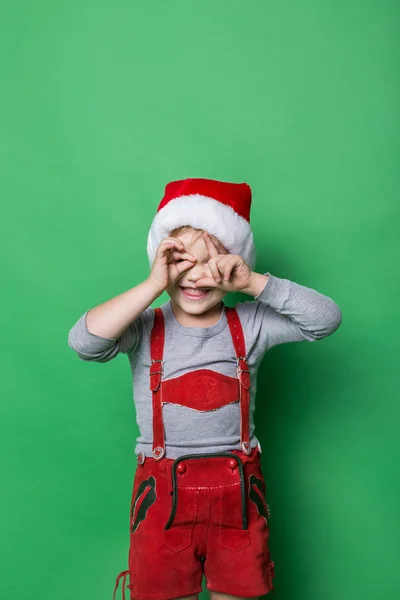 Naughty kid dressed like christmas elf — Stock Photo, Image