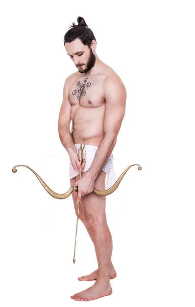 Handsome brawny young man drawing a bow. Antiquity, Valentine, Cupid — Stock Photo, Image