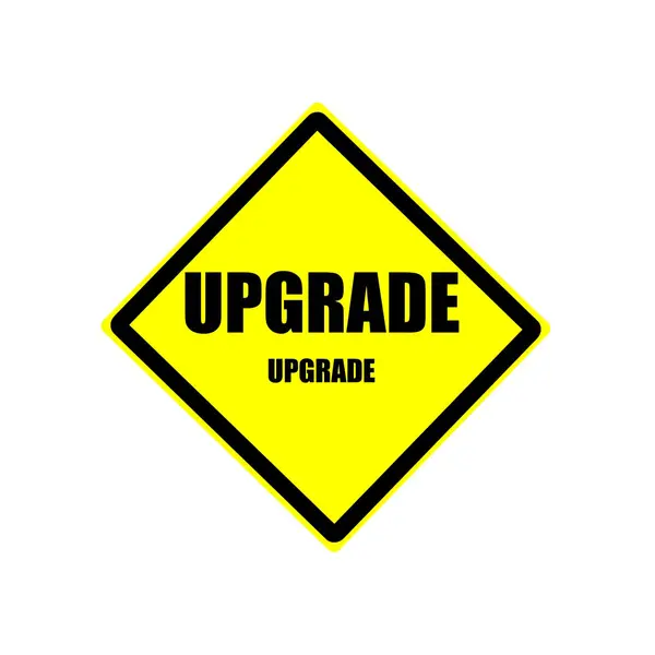 Upgrade black stamp text on yellow background — Stock Photo, Image