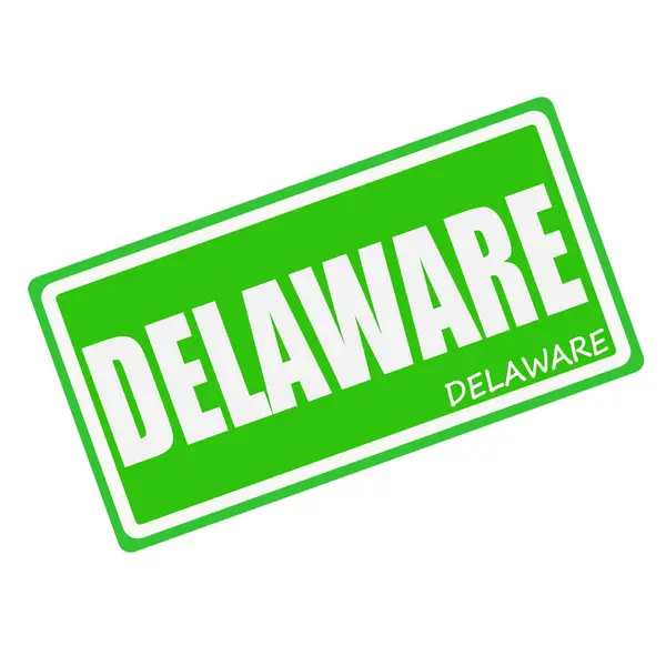 DELAWARE white stamp text on green — 图库照片
