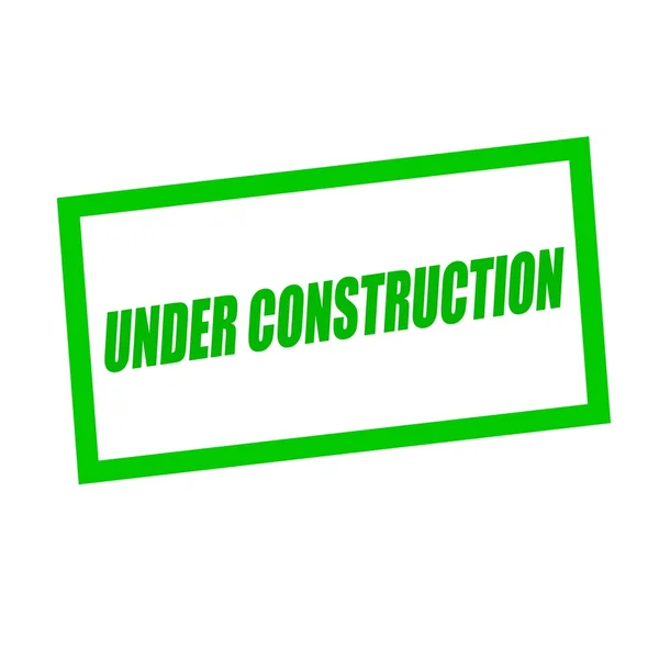 Under construction green stamp text on white — Stock Photo, Image