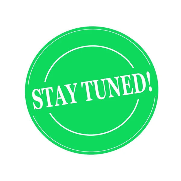 Stay tuned white stamp text on circle on green background — Stock Photo, Image