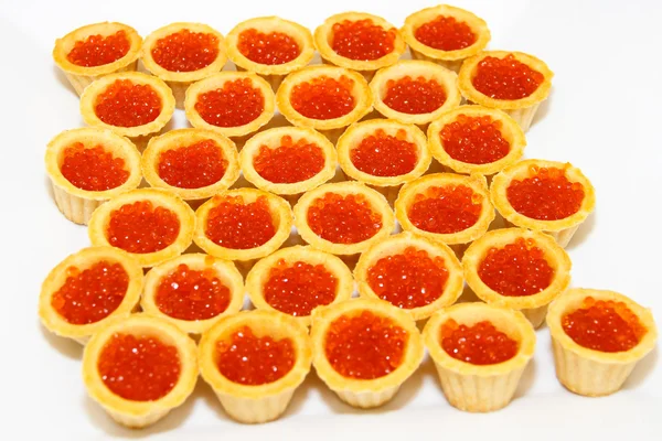 Tartlets with salmon caviar,  fish a delicacy. Royalty Free Stock Images