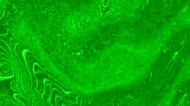 Hareket eden parçacıkların yeşil parlayan arkaplanı.