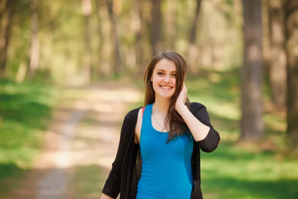 Young brunette Girl in a park — Stock Photo, Image