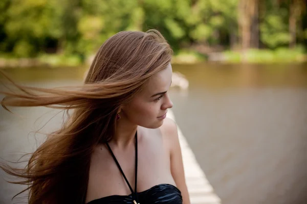 Girl in swimsuit posing at sunset — Stock Photo, Image