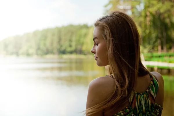The thoughtful woman near the river — Stock Photo, Image