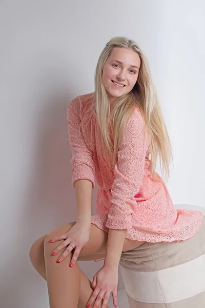 Sexy blond in pink dress. Studio. Vertical photo — Stock Photo, Image