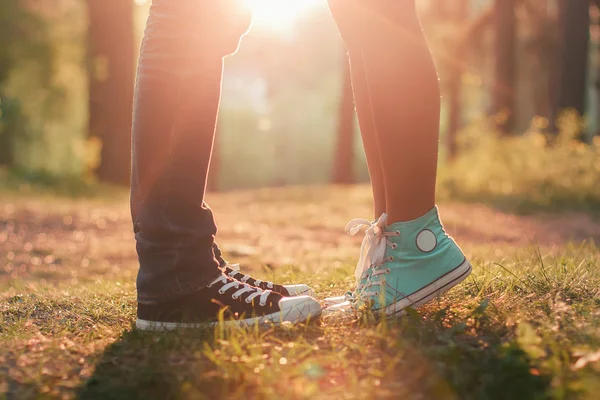 Young couple kissing in summer sun light